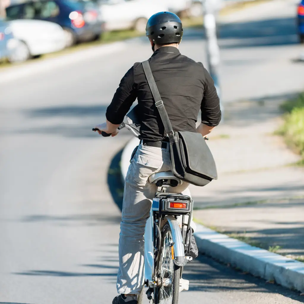 E-bike rider checking route conditions and remaining battery range