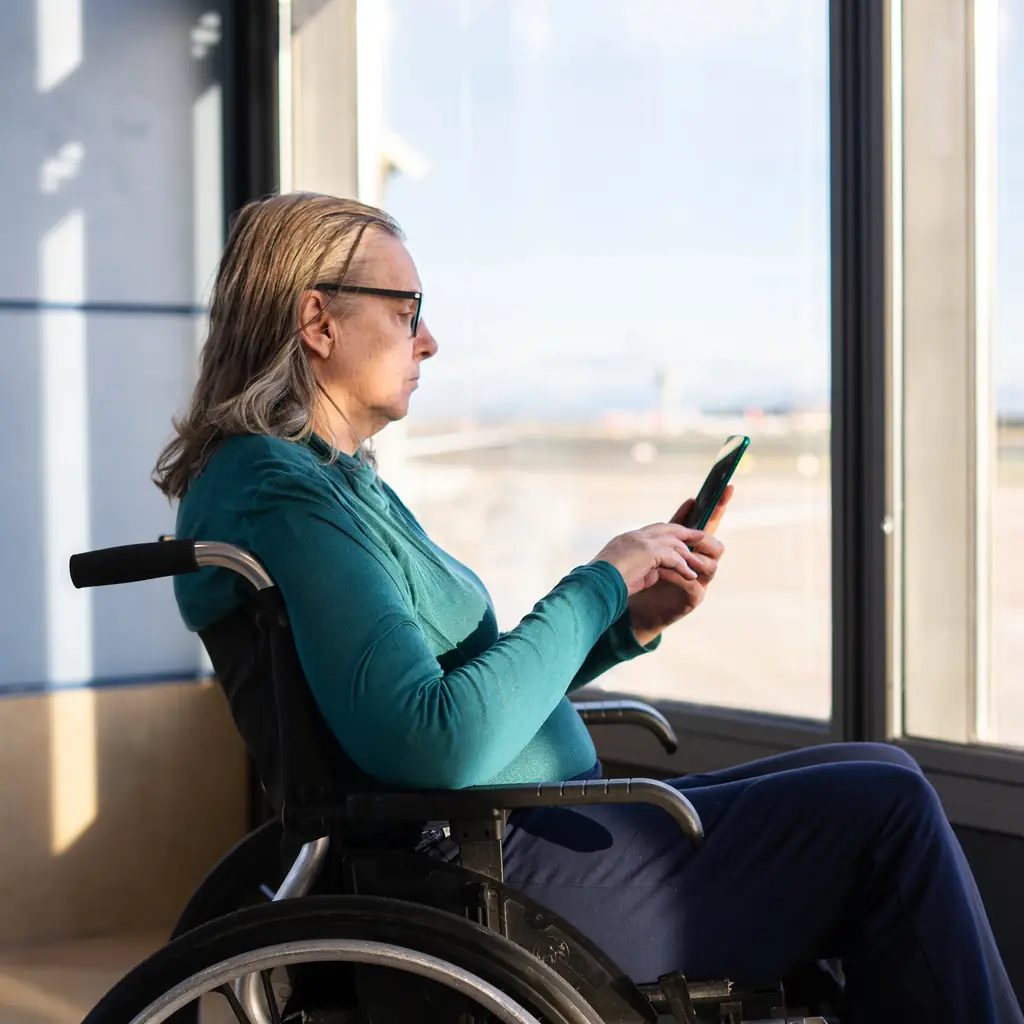 Older cycling traveler calling an insurer before an overseas trip